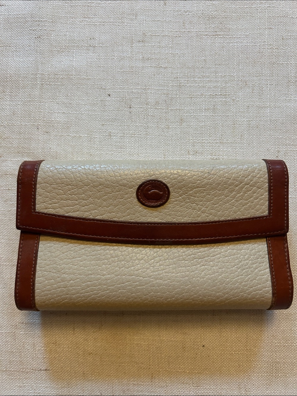 Dooney & Bourke Cream Pebbled Leather Wallet with Brown Trim
